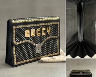  Alessandro Michele for Gucci 2018 Guccy x Sega 80’s homage clutch! A black calfskin leather Gucci Guccy Star Print Portfolio bag featuring gold border detailing, Sega-style lettering, and aged silver hardware; authenticated by Entrupy.