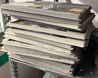 Stacked trays of organized watch bands and watch components