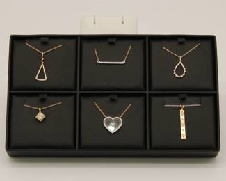 Six 14k gold and diamond pendants