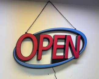 A lighted "open" sign