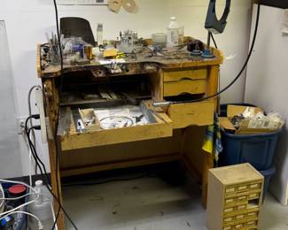 A vintage jewelers' bench and tools