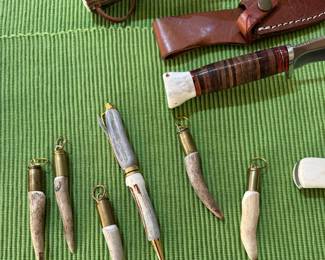 Artisan-crafted deer antler keychain charms featuring repurposed brass bullet casings, and a matching antler pen