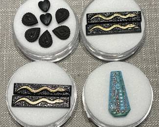 Antique costume jewelry components : Upper left French Jet, the other three Egyptian Revival themed 