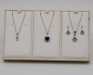 Gold and gemstone pendant necklaces - Aquamarine, blue topaz and diamond, and a blue topaz and diamond pendant necklace and earrings set