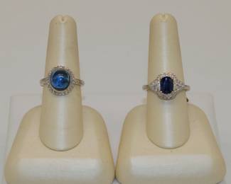 Sapphire, diamond, and platinum rings - a cabochon sapphire on the left and a cushion-cut sapphire stone on the right.