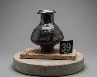 Lot039 BlackCeramicVesselonStone