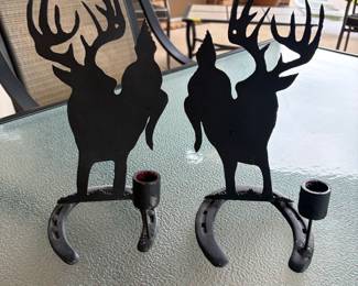 Pair of deer on horseshoe candle stick holders
