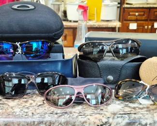 Men's and woman's sunglasses. Maui Jim, Oakley, Bolle