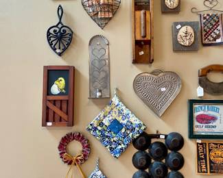 we have an entire wall of vintage kitchen tools, art and display pieces, it's really a work of art