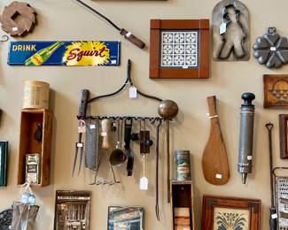 we have an entire wall of vintage kitchen tools, art and display pieces, it's really a work of art