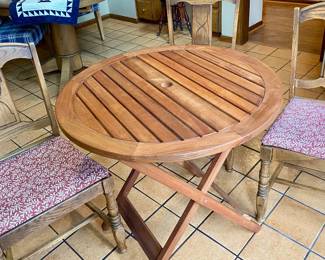 there are three matching padded oak chairs 