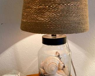 there are two of these cute nautical lamps with shells 