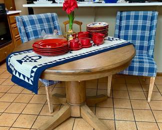 charming round farm table with two upholstered chairs 
