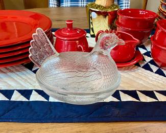 red dishes and vintage glass hen on nest 