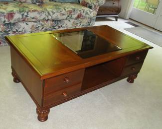 Coffee table with drawers and glass center