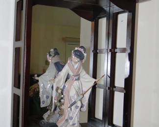 Oriental Lladro and display cabinet