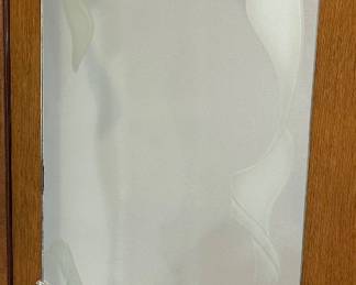 Frosted glass mirror  featuring a custom sandblast etched design.