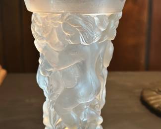 This is an Art Deco style vase featuring frosted glass figures, often attributed to Czech glassmakers 