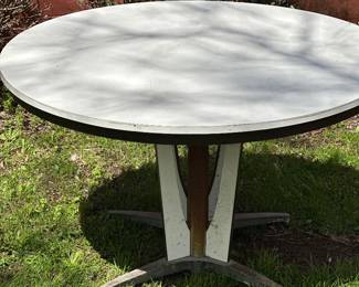 Vintage mid-century modern round dining table produced by the Chromcraft brand.