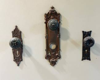 Antique door hardware sets feature intricate designs from the late 19th and early 20th centuries