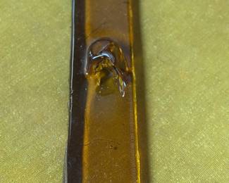 Amber glass  vintage mid-century modern cigar ashtray, often attributed to designers like Blenko Glass Company.