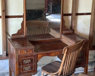 Antique oak dressing table with a mirror.