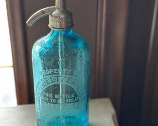 Vintage blue glass seltzer bottle (or soda siphon) from the New York Seltzer Water Co. of Detroit, Michigan, typically dating to the 1930s