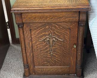 Antique empty sewing machine cabinet