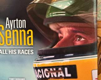 Hardcover biography titled "Ayrton Senna: All His Races" by Tony Dodgins, featuring a foreword by Martin Brundle.