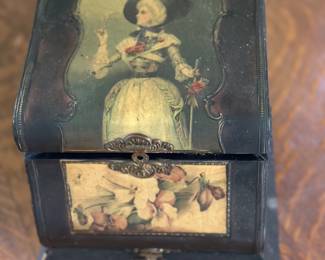 The item  is a Victorian-style celluloid dresser or vanity box