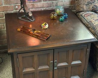 Vintage wood end table with paneled cabinet doors