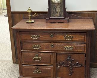 This is an antique Victorian Eastlake  oak cabinet