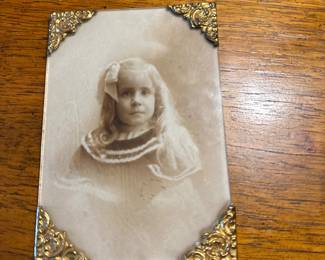 Antique 19th-century photograph portrait of a young girl.
