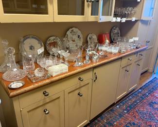 Glassware and decorative porcelain  for sale during in-person shopping.