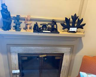 Collectible sculptures for sale during in-person shopping.