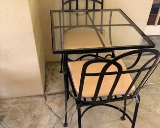 One of two small tables which can be added together to form a dining table in the previous picture or used separately as shown here. They are each 25 in.² and 29 1/2 inches high.