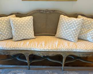 $2400. Antique caned and wood bench with cushions. 76"w x 19"d x 37.5h.