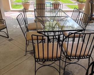 Two tables put end on end to for a dining table. Each table is 30 in.² by 29 1/4 inches high. Shown here with eight straight back chairs. Chairs are 17 inches wide by 15 inches deep by 32 inches high. There are eight in total.