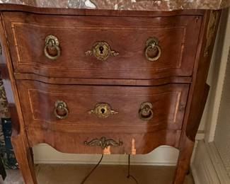 Close-up of the second bedside table with as found on the veneer at the base