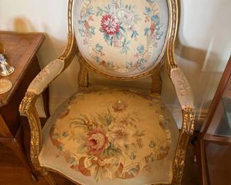 $2200. Pair of fauteuil open armchairs. Gold leaf over gesso. Louis the 14th style with oval back and floral tapestry upholstery Aubusson style 19th century . 25 inches wide by 21 inches deep by 39 inches high.