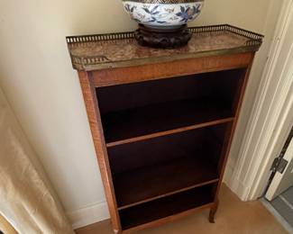 Antique marble top with metal rail edge bookshelf. 24 inches wide by 9.5 inches deep by 39 inches high. As found issue shown in next photo.