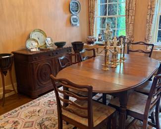 $650. Antique dining table. 42 inches wide by 73 1/2 inches long by 30 1/2 inches high as shown in this picture. Three more 10 inch leaves. Five side chairs and one captains chair. Art on wall no longer in the home. Chairs measure 19 1/2 inches wide by 17 1/2 inches deep by 35 1/2 inches high. Chairs are 19.5" w x 17.5"d x 35.5"h. Three additional 11" leaves.