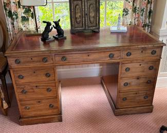 Antique leather top desk. 53 1/2 inches wide by 28 inches deep by 38 inches high.