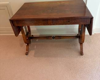 Pembroke style library table with drop leaf ends. 41 inches wide by 27.5 inches deep by 29 inches high as . Each leaf is 11 inches. as found issue in photos.