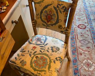 The eighth chair is upholstered in a different fabric and was used at a desk in the same room