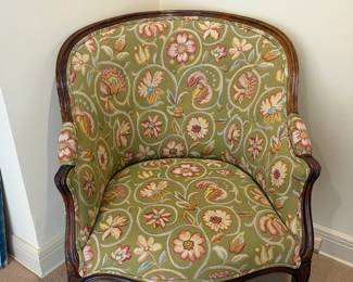 Curved back armchair with beautiful upholstery. 32 inches wide by 30 inches deep by 38 1/2 inches high.