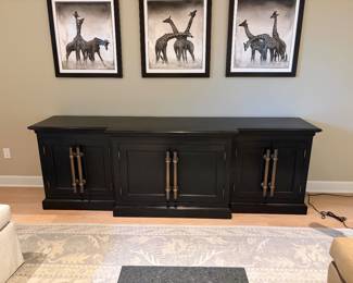 Console with three storage areas with adj. shelves. 74"w x 28.5"d x 27.5"h.