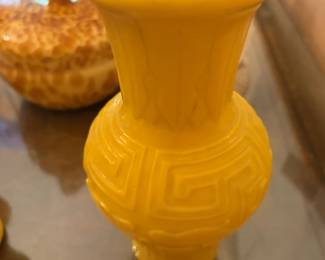 $450. Chinese yellow peeking glass carved banana, leaf motif and Greek key fret. 8 inches high.