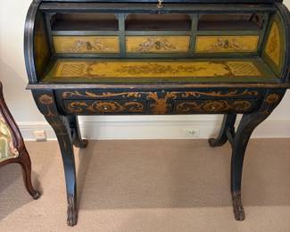 Antique roll top desk shown with the roll top open