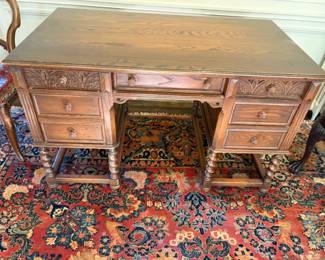 $280. Antique barley twist carved detailing partner's desk. 49 inches wide by 28 inches deep by 30 1/2 inches high.